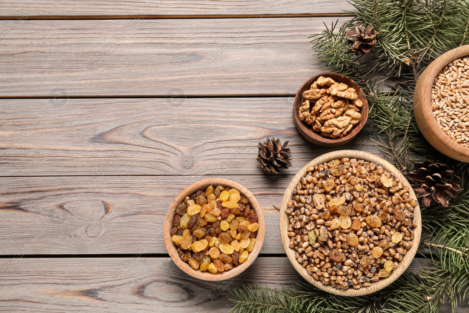 Photo of Traditional Christmas slavic dish kutia served on wooden table, flat lay. Space for text