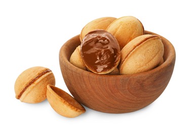 Photo of Delicious nut shaped cookies with boiled condensed milk in wooden bowl on white background