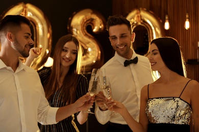 Photo of Young people celebrating New Year in club