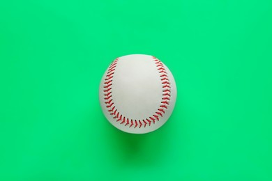 Photo of Baseball ball on green background, top view. Sports game