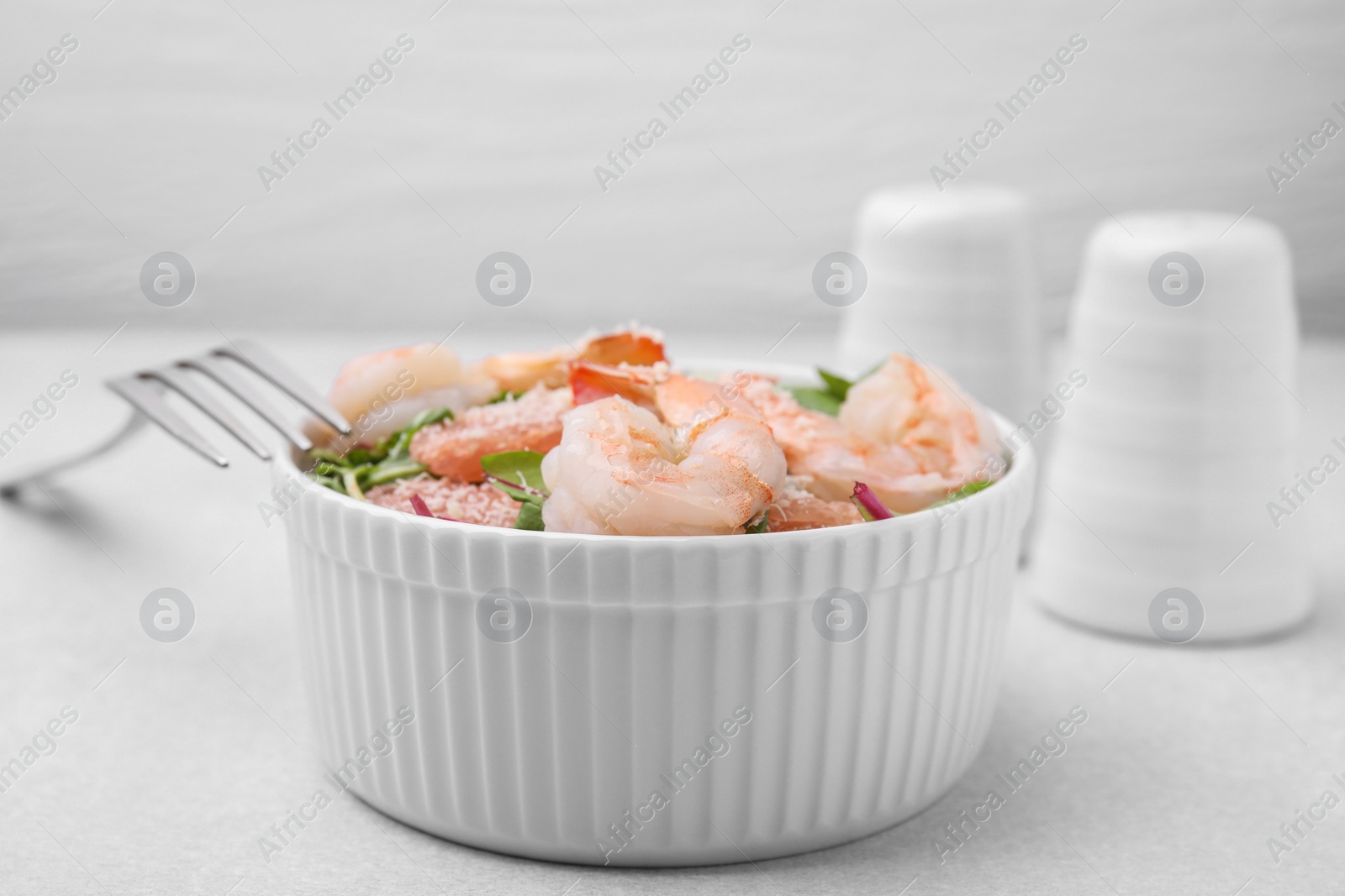 Photo of Delicious salad with pomelo, shrimps and tomatoes on white table