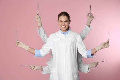 Photo of Female dentist with multiple hands holding tools on color background