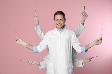 Female dentist with multiple hands holding tools on color background