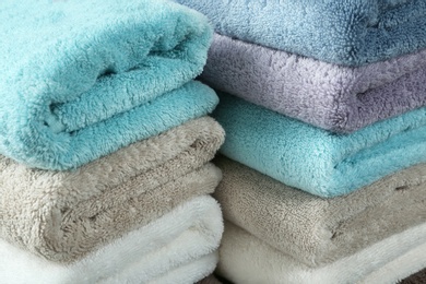 Photo of Pile of different soft terry towels, closeup