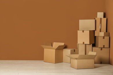 Photo of Cardboard boxes on floor indoors