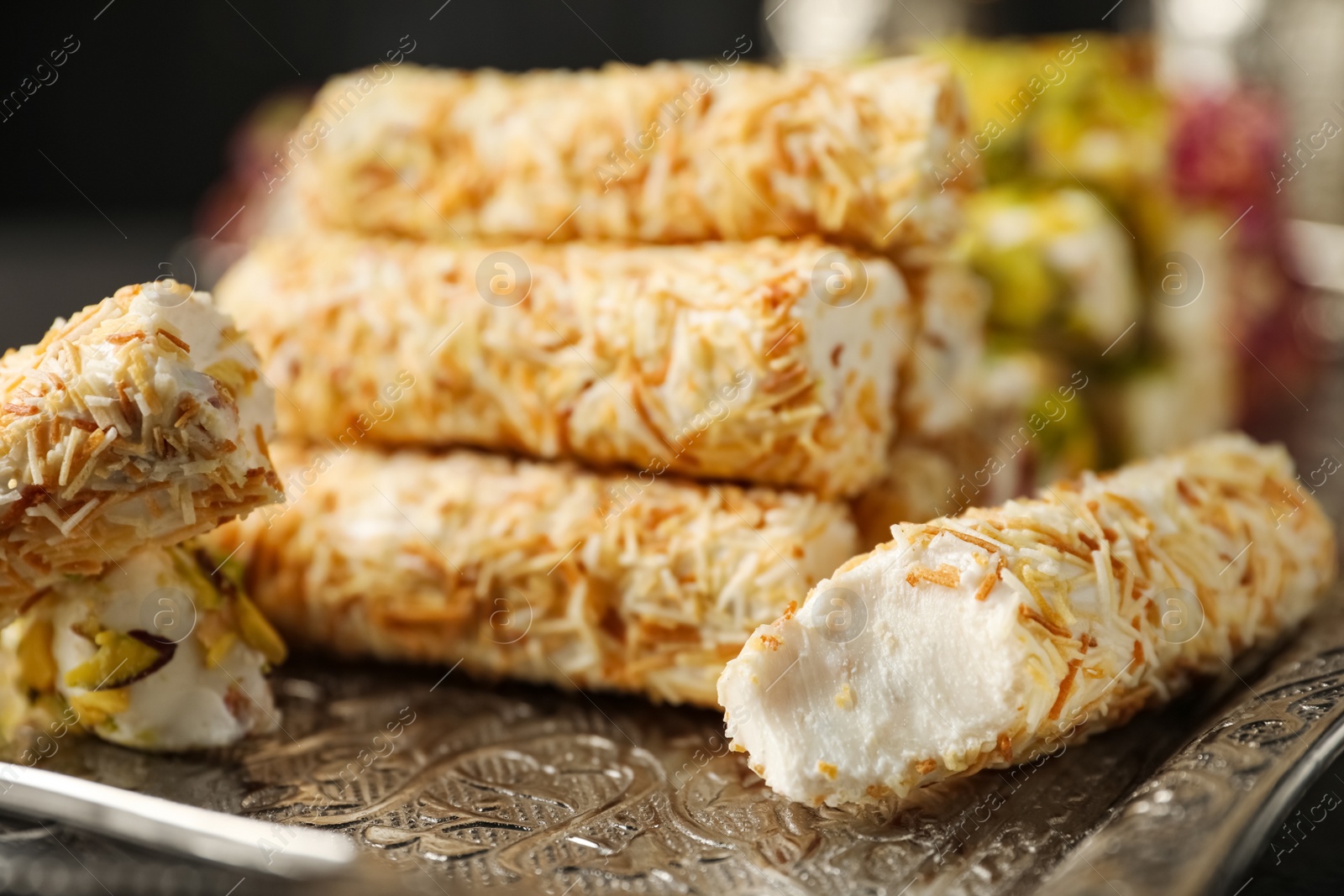 Photo of Turkish delight dessert on tray, closeup. Traditional sweet