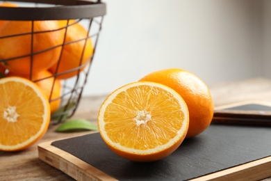 Fresh juicy oranges on cutting board. Healthy fruit