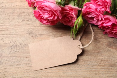 Photo of Happy Mother's Day. Beautiful flowers and blank card on wooden table