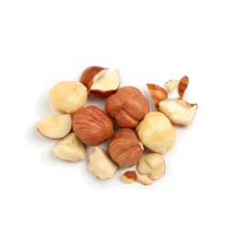 Photo of Heap of tasty hazelnuts on white background, top view