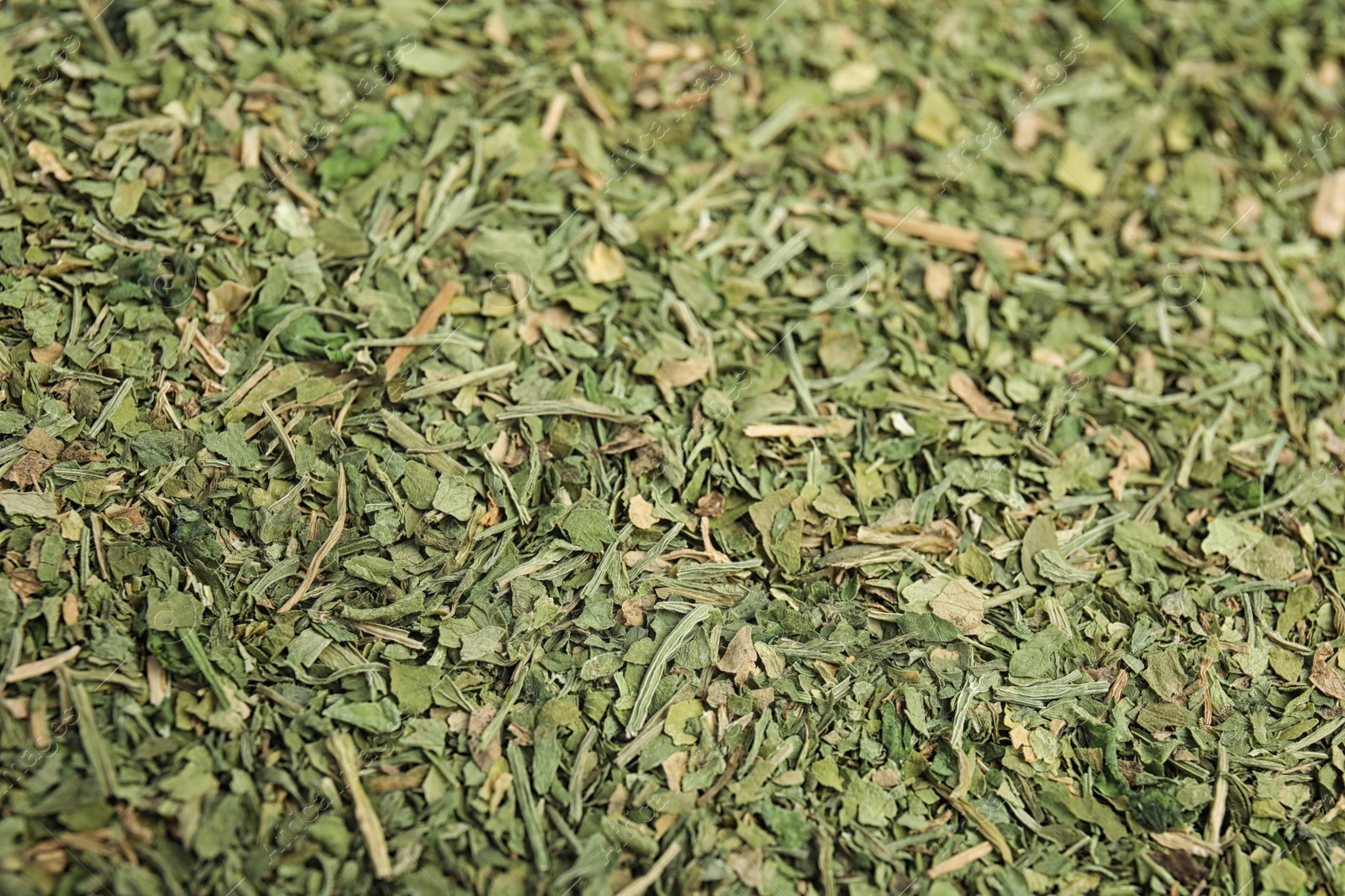 Photo of Heap of dried parsley as background, closeup