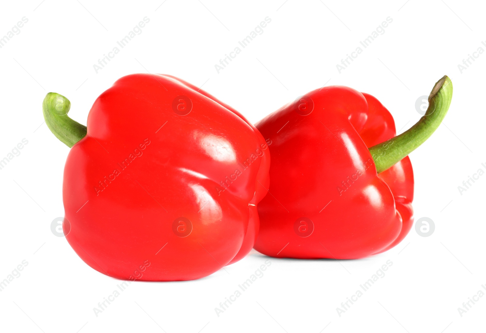 Photo of Tasty ripe red bell peppers on white background