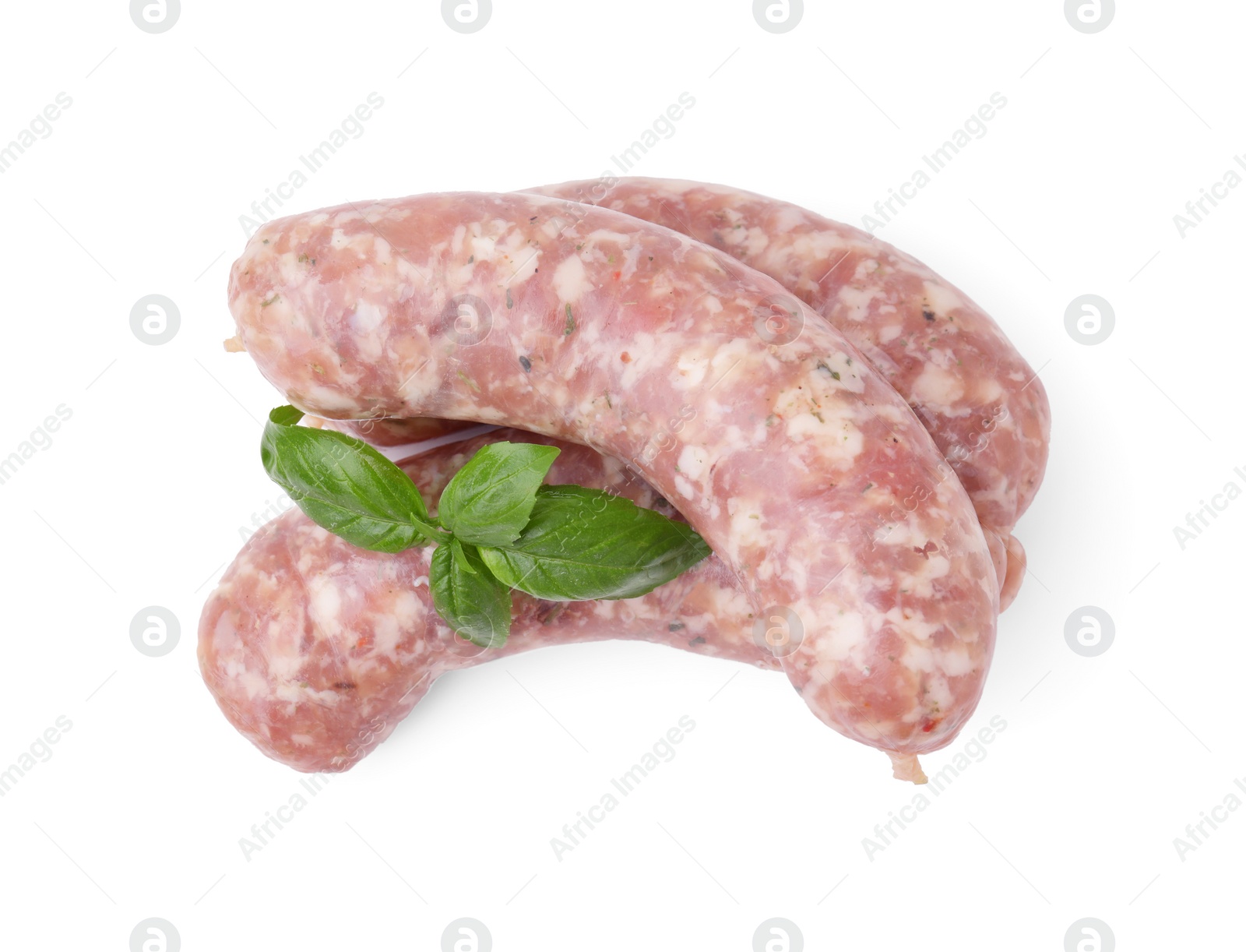 Photo of Raw homemade sausages and basil leaves isolated on white, top view