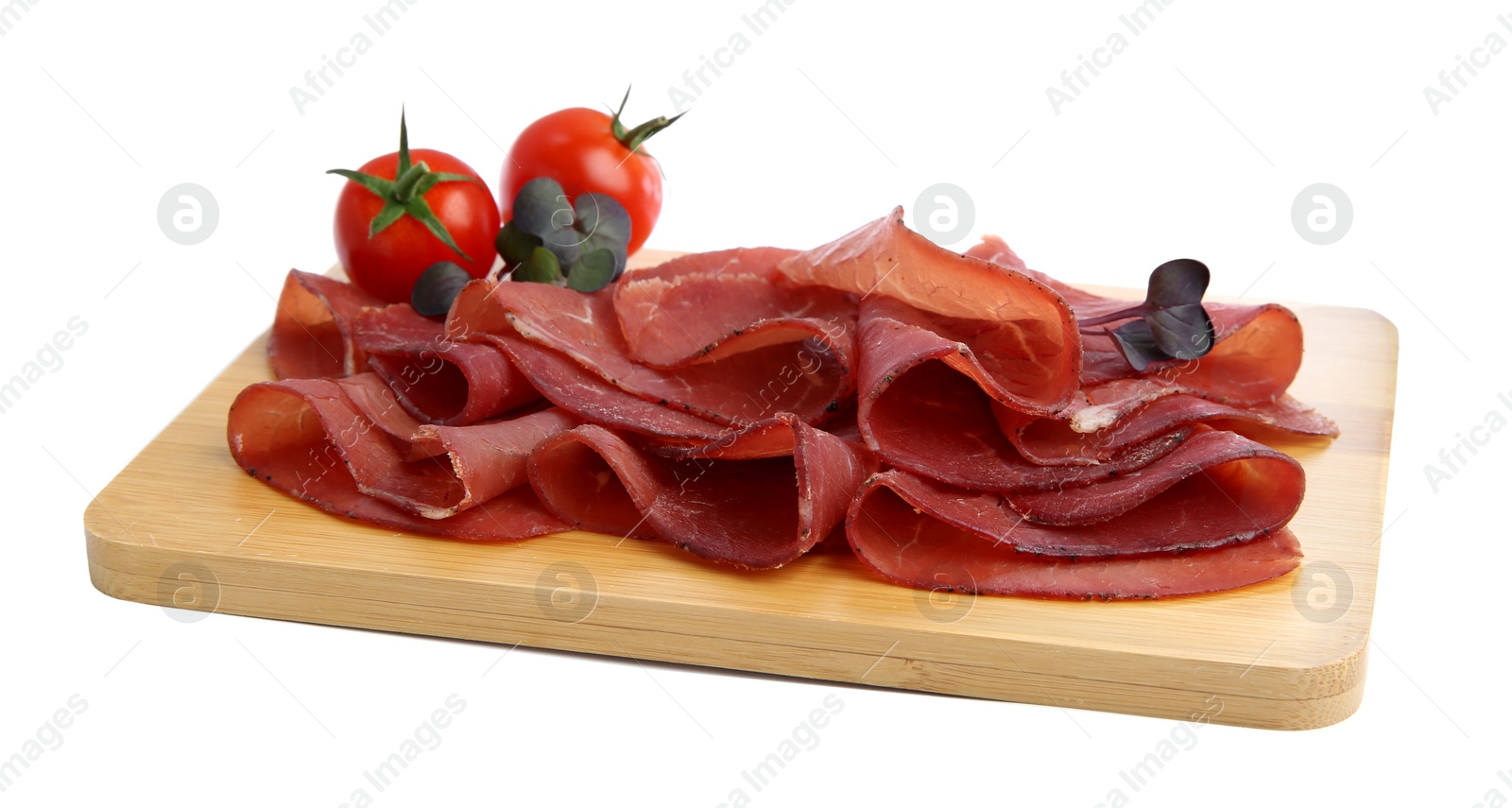 Photo of Slices of tasty bresaola and tomatoes isolated on white