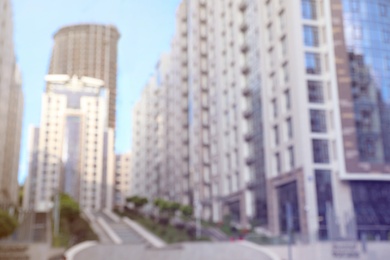 Photo of Blurred view of modern buildings in city