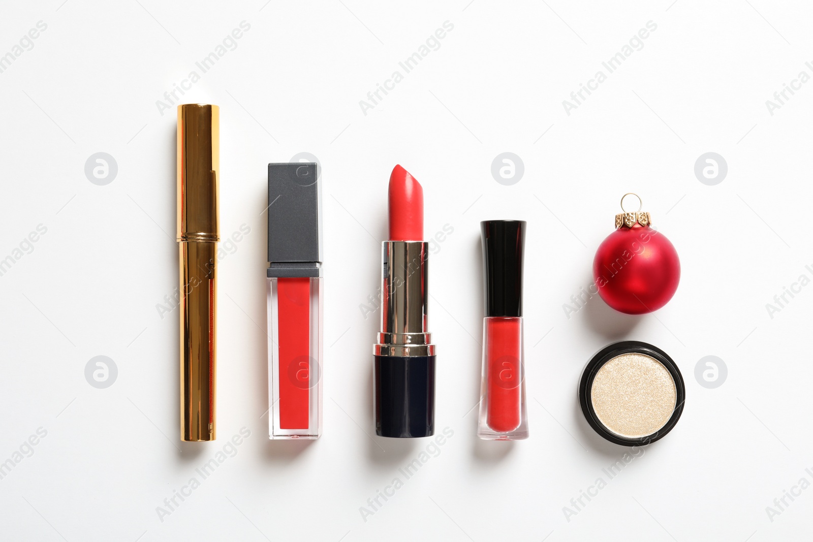 Photo of Flat lay composition with makeup products and Christmas decor on white background