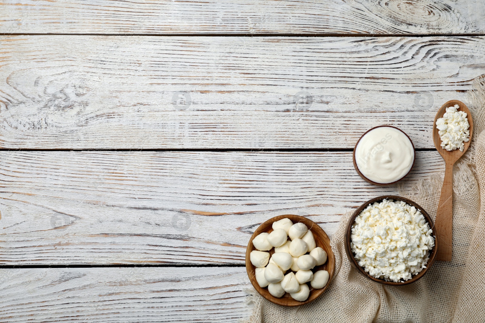 Photo of Different dairy products on wooden background