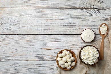 Photo of Different dairy products on wooden background