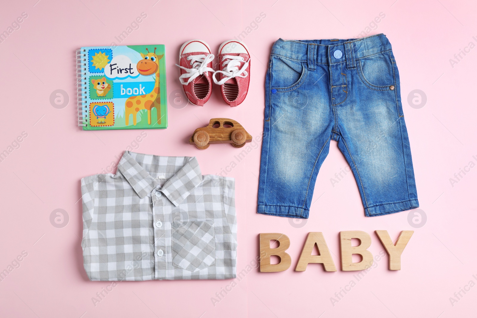 Photo of Flat lay composition with cute clothes on color background. Baby accessories