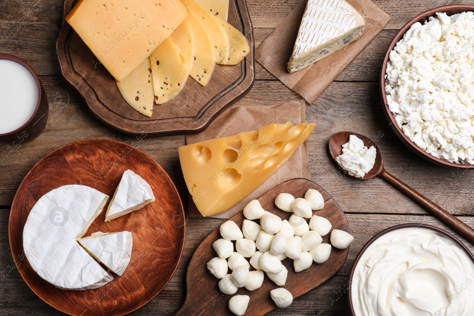 Photo of Flat lay composition with dairy products on wooden table