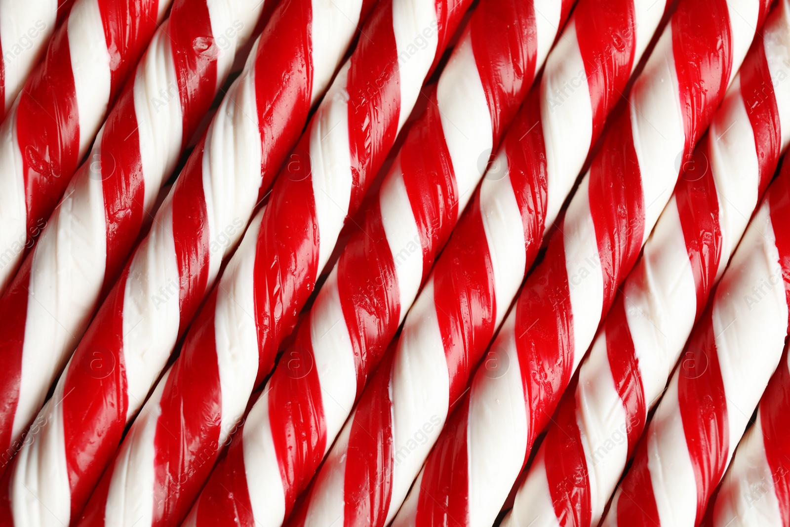 Photo of Many candy canes as background. Festive treat