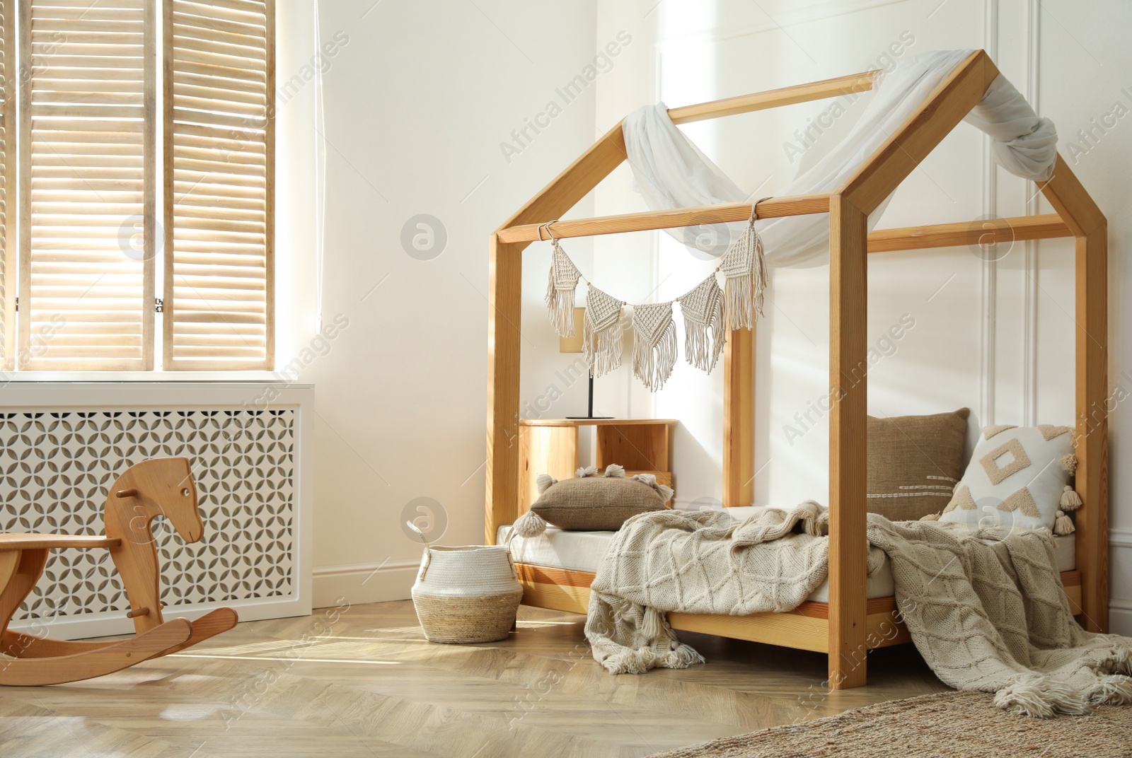 Photo of Stylish child room interior with house bed