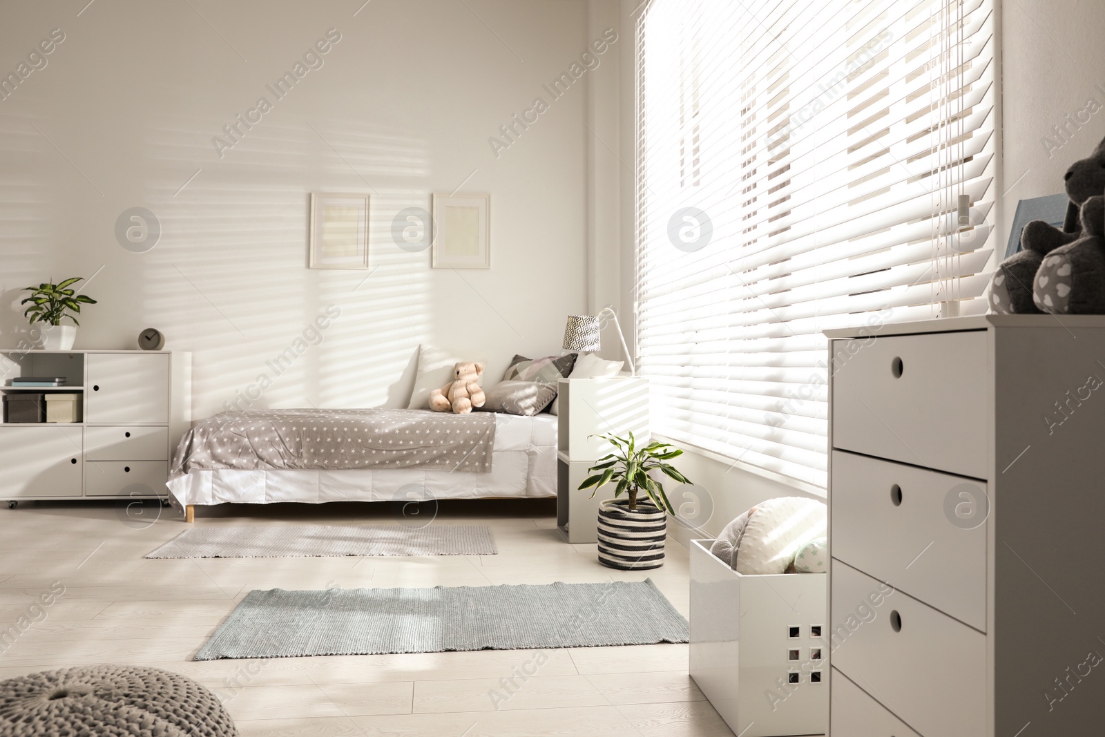 Photo of Modern child room interior with comfortable bed