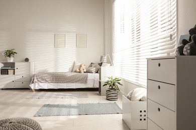 Photo of Modern child room interior with comfortable bed