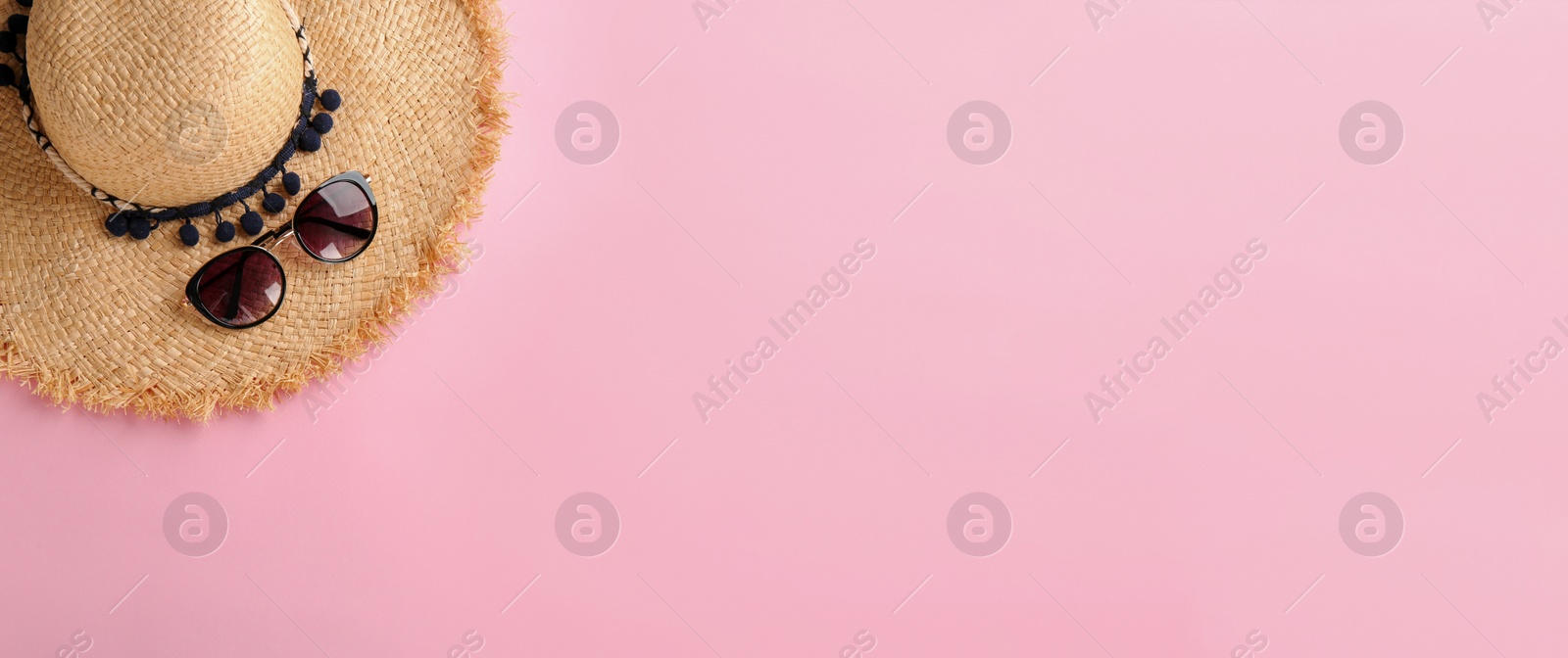 Image of Stylish hat and sunglasses on color background, top view with space for text. Banner design