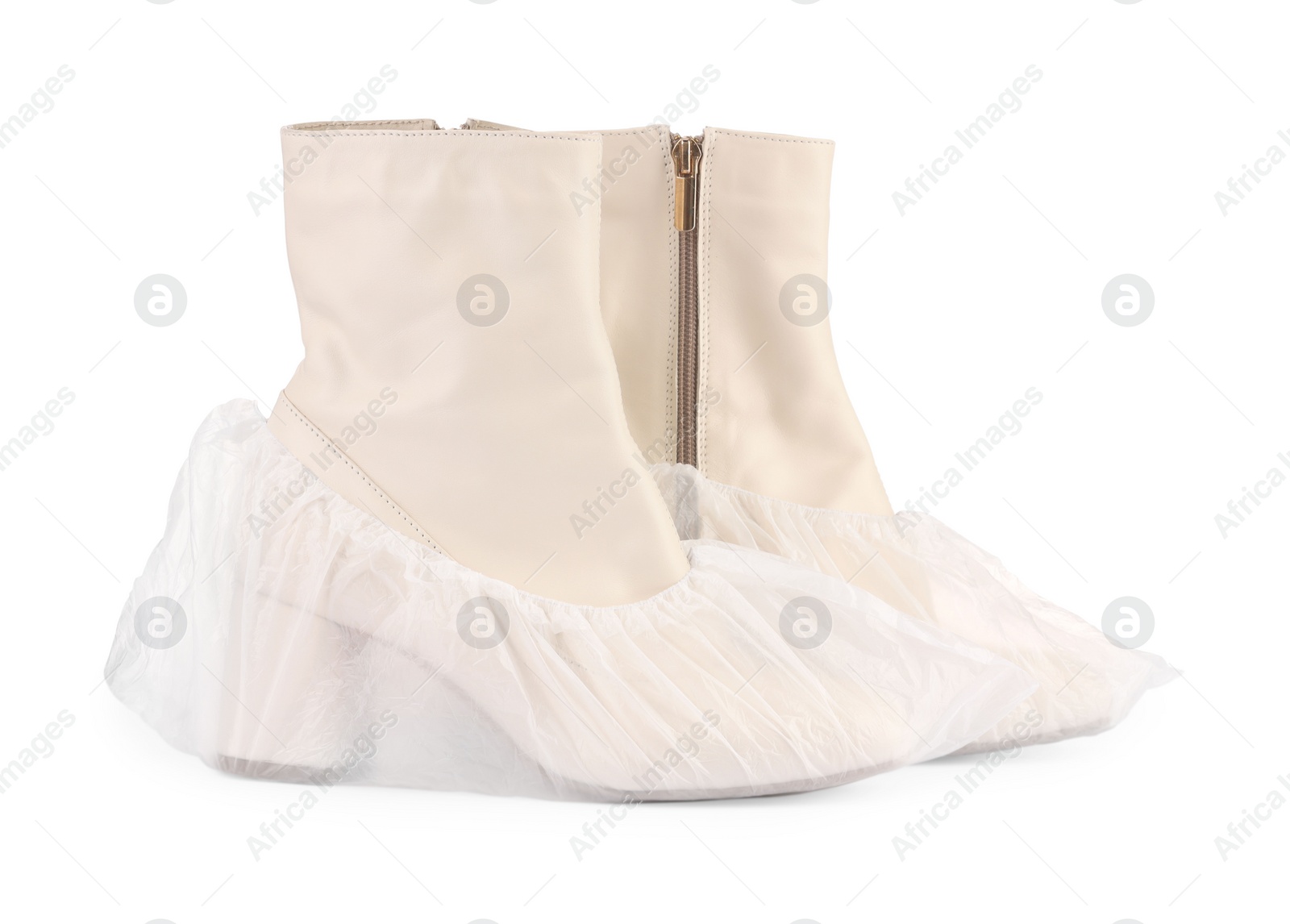 Photo of Women's boots in shoe covers isolated on white