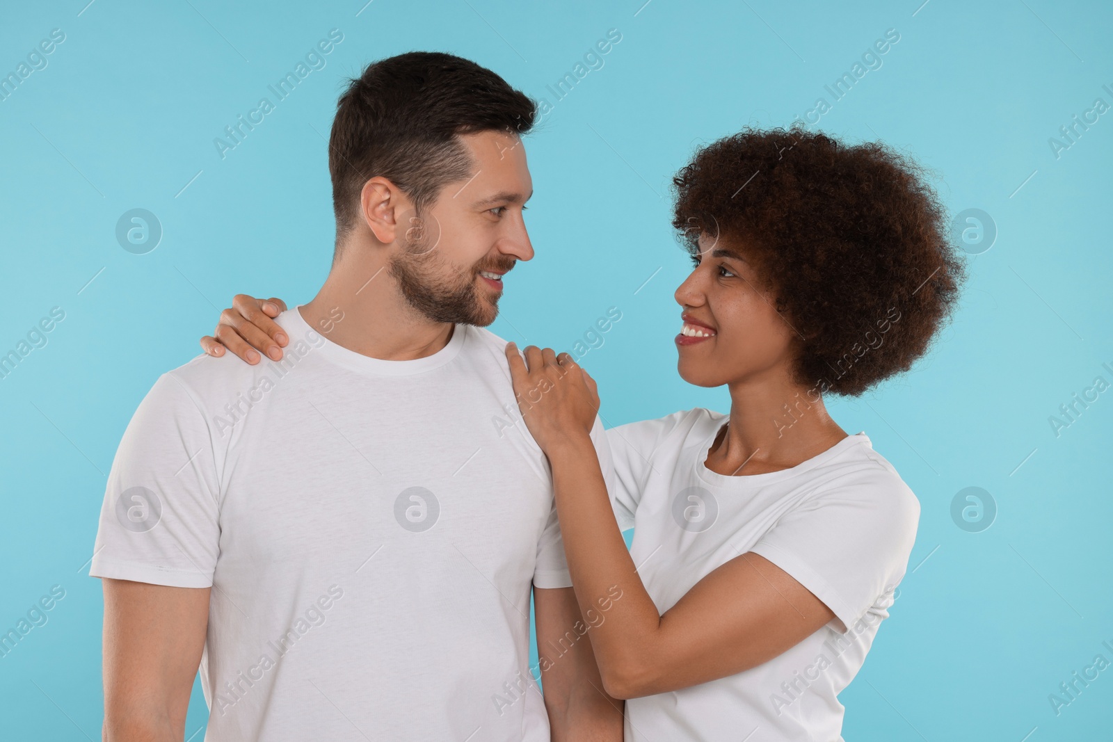 Photo of International dating. Portrait of happy couple on light blue background