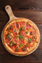 Photo of Delicious pizza Diablo on wooden table, top view