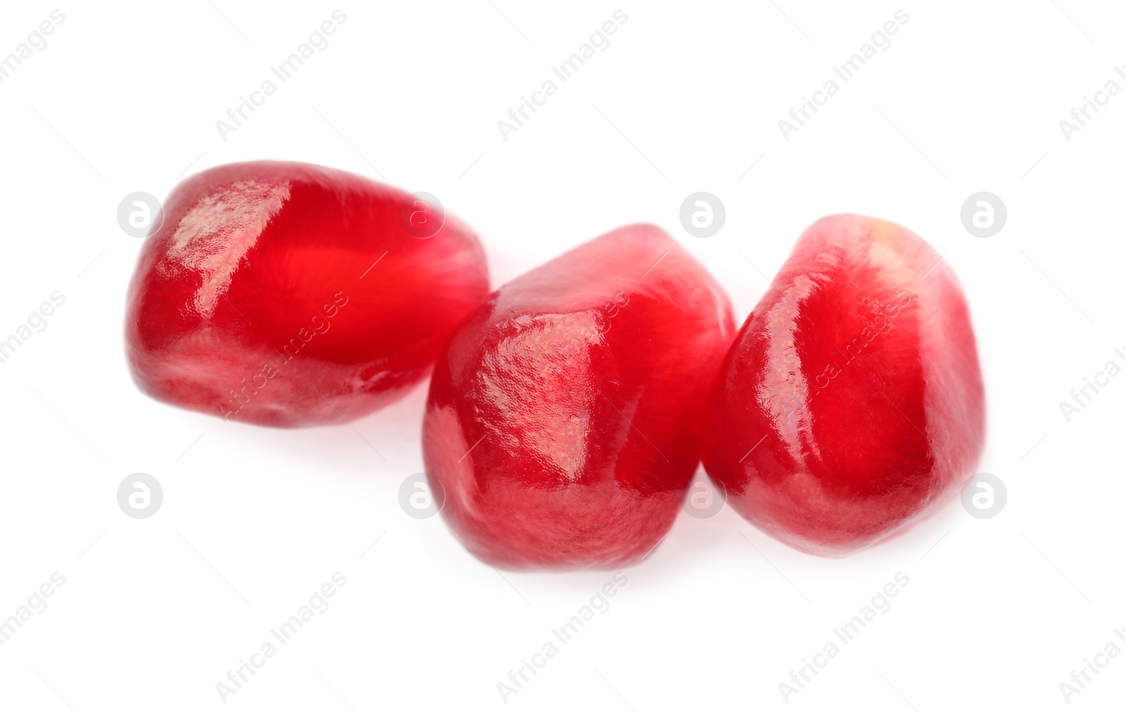 Photo of Tasty pomegranate seeds on white background, top view