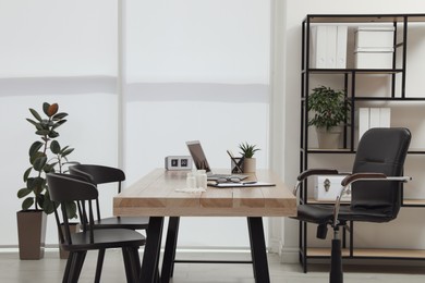 Photo of Modern medical office interior with doctor's workplace