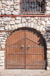 Photo of Entrance of house with beautiful old wooden gates
