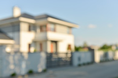 Photo of Blurred view of modern house on sunny day