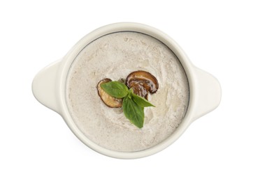 Photo of Fresh homemade mushroom soup in ceramic pot isolated on white, top view