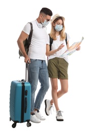 Photo of Couple in face masks with map on white background. Summer travel