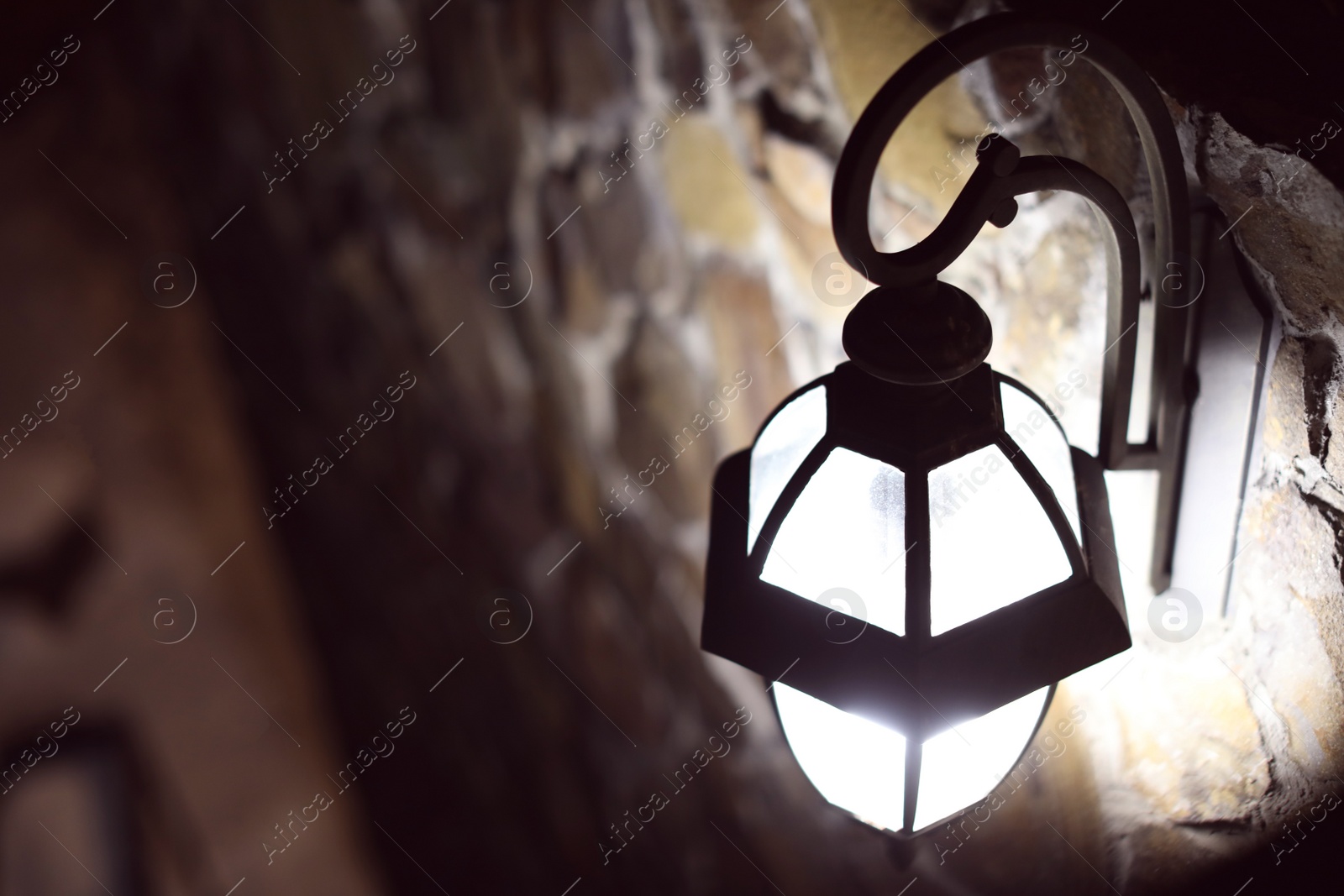 Photo of Vintage street lamp on wall of building. Space for text