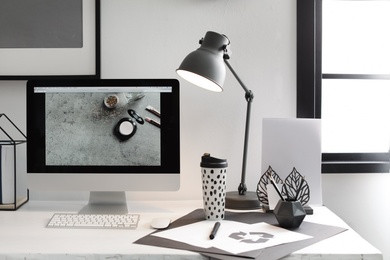 Photo of Stylish workplace with modern computer on desk