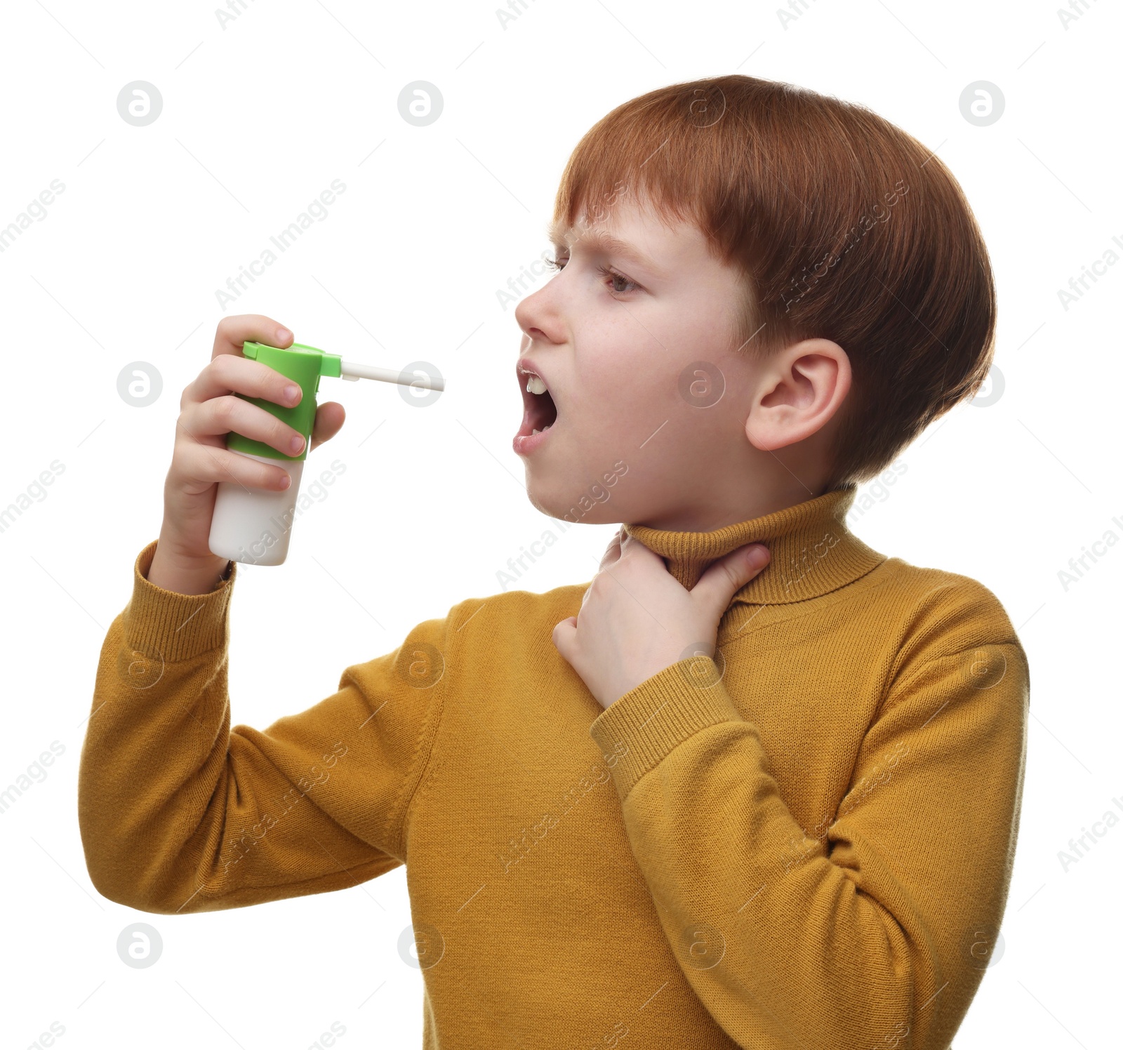 Photo of Little boy using throat spray on white background