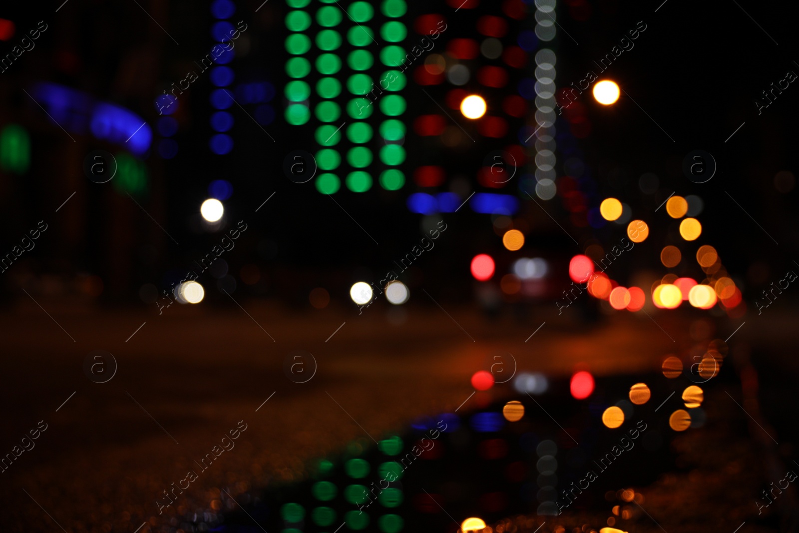 Photo of Blurred view of cityscape with bokeh effect. Night life