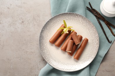 Photo of Glazed vanilla curd cheese bars served on grey table, top view