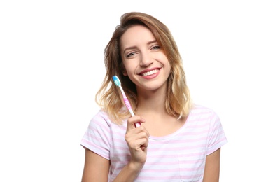 Photo of Portrait of young woman with toothbrush on white background