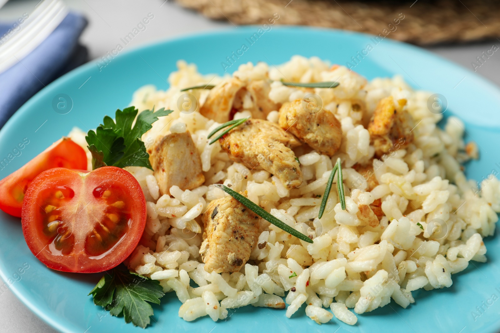 Photo of Delicious risotto with chicken on plate, closeup