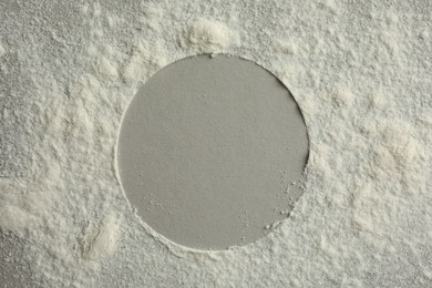 Photo of Frame made of rice loose face powder on light grey background, top view. Space for text