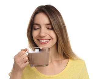 Young woman drinking chocolate milk on white background