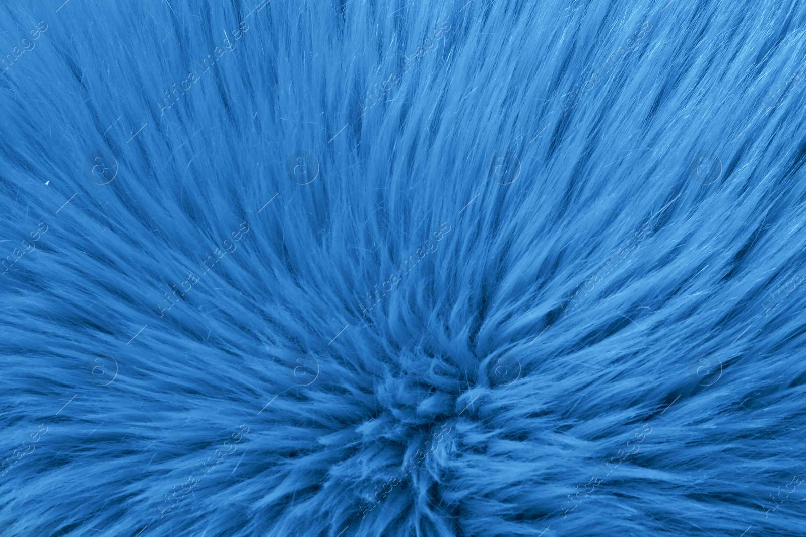 Photo of Faux fur as background, top view. Color of the year 2020 (Classic blue)