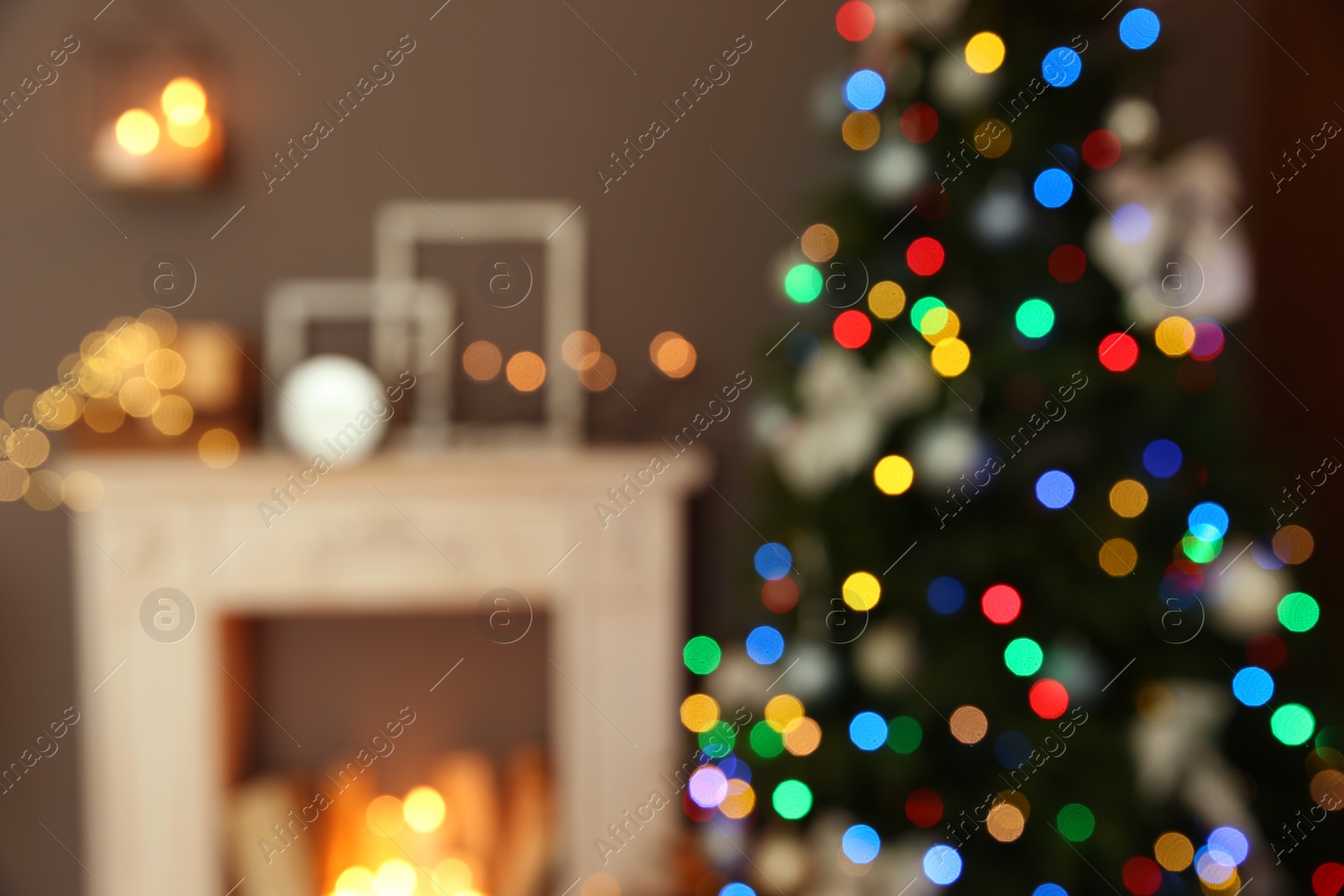 Photo of Blurred stylish room interior with Christmas tree and decorative fireplace