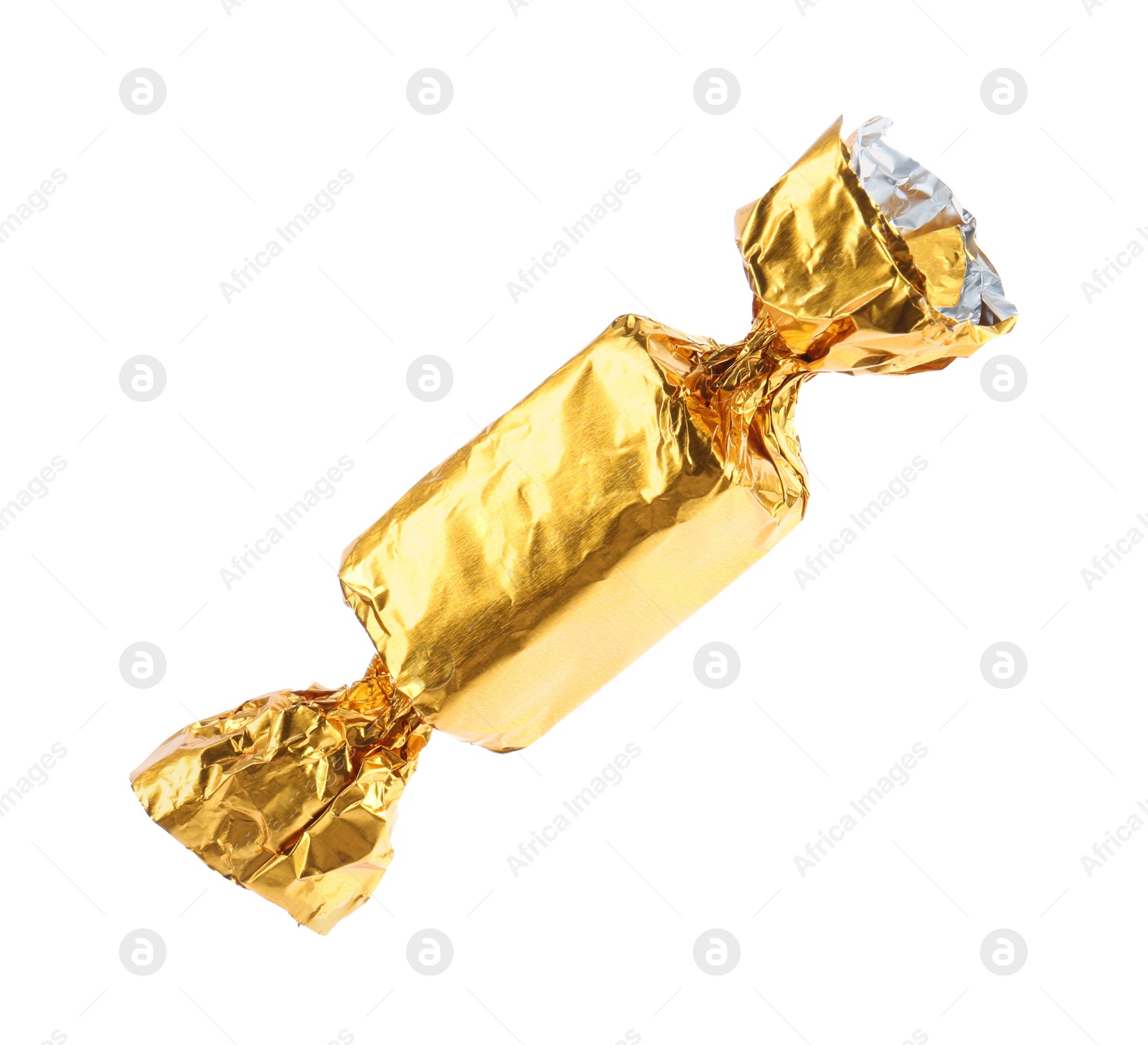 Photo of Tasty candy in golden wrapper isolated on white