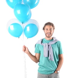Photo of Young man with air balloons on white background